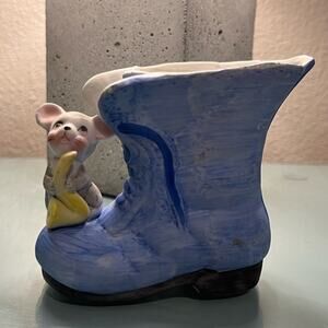 Vintage Ardco mouse sitting on boot planter